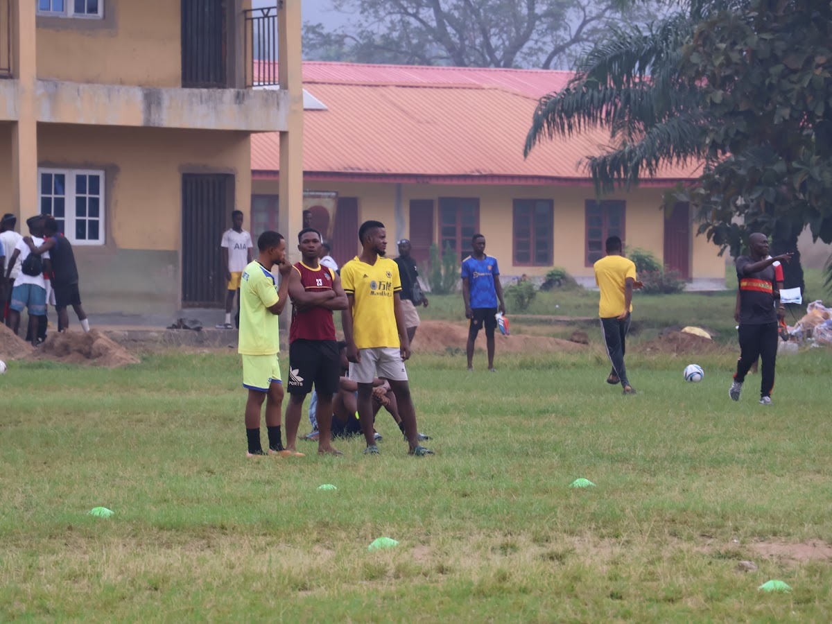 Players gathered on a community football field.